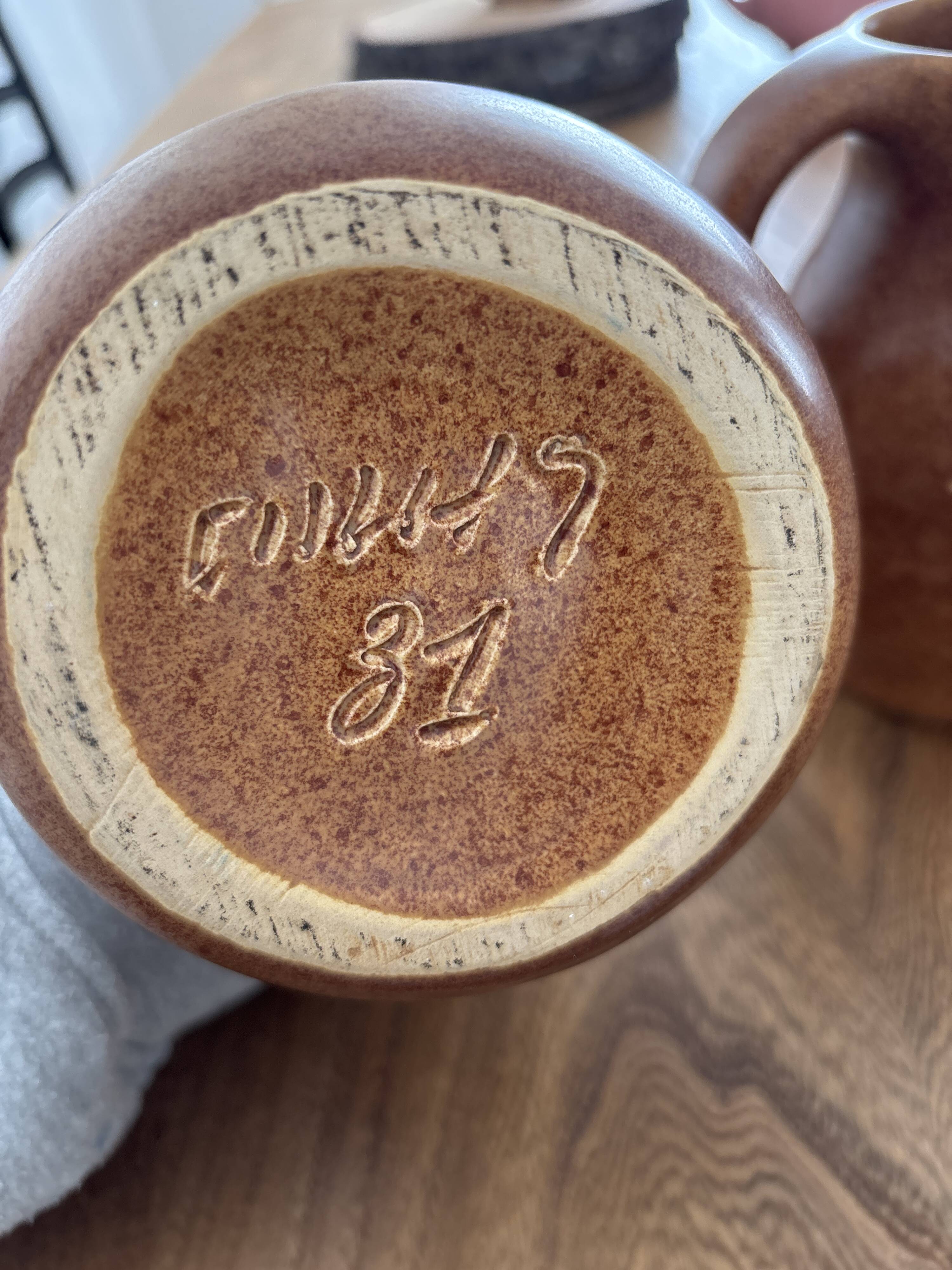 Vintage brown ceramic pitcher signed Max Idlas.