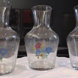 3 glass carafes, vintage. Very pretty floral pattern.