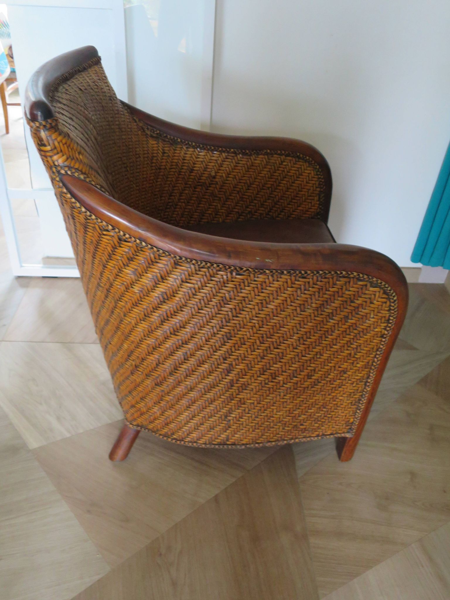Woven rattan armchair and exotic wood in colonial style, 1980s.