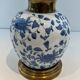 Pair of porcelain lamps with Chinese-style decorations and brass.