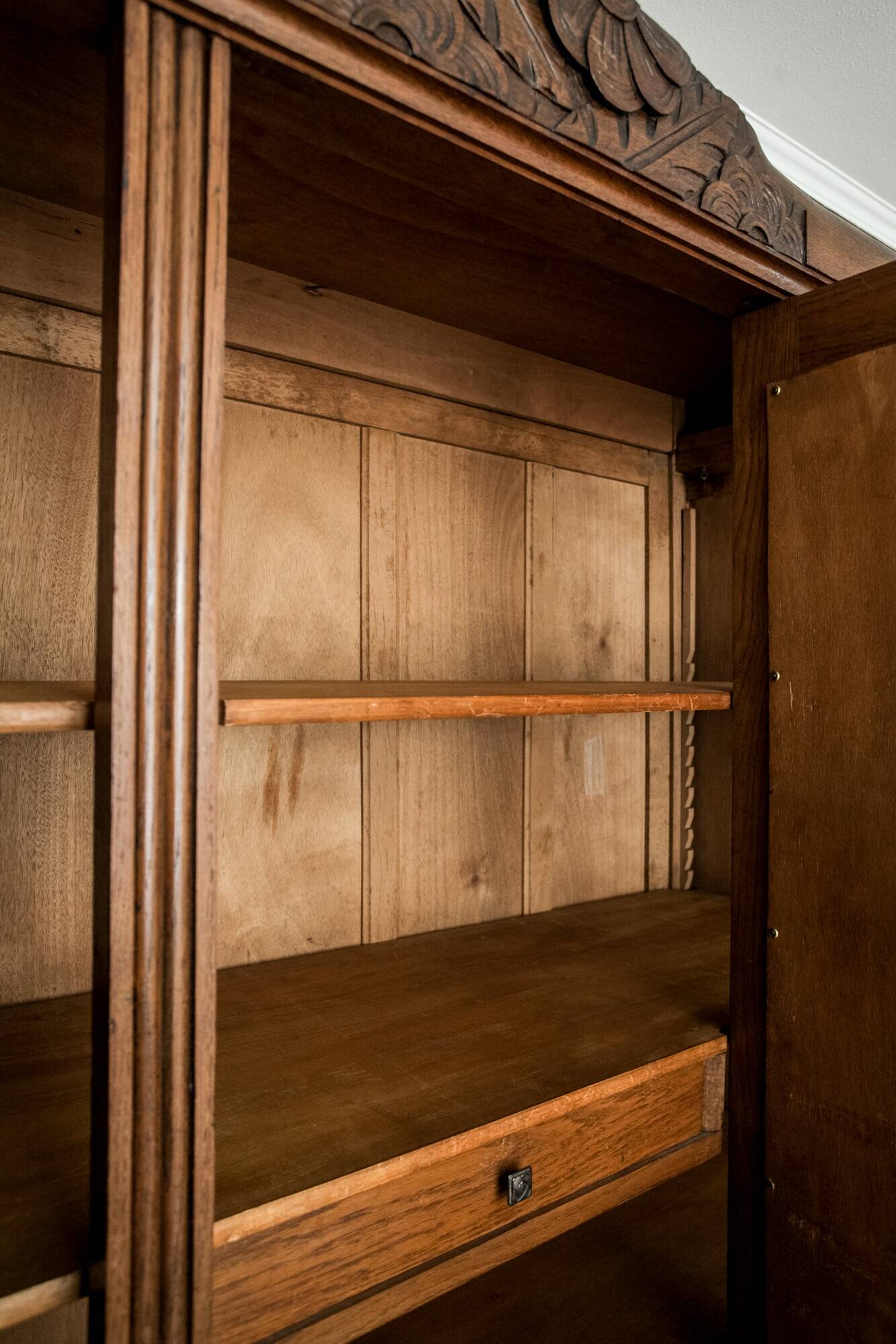 Old solid wood wardrobe with three vintage mirror doors