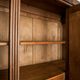 Old solid wood wardrobe with three vintage mirror doors