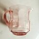 Pitcher and 2 glasses in pink glass