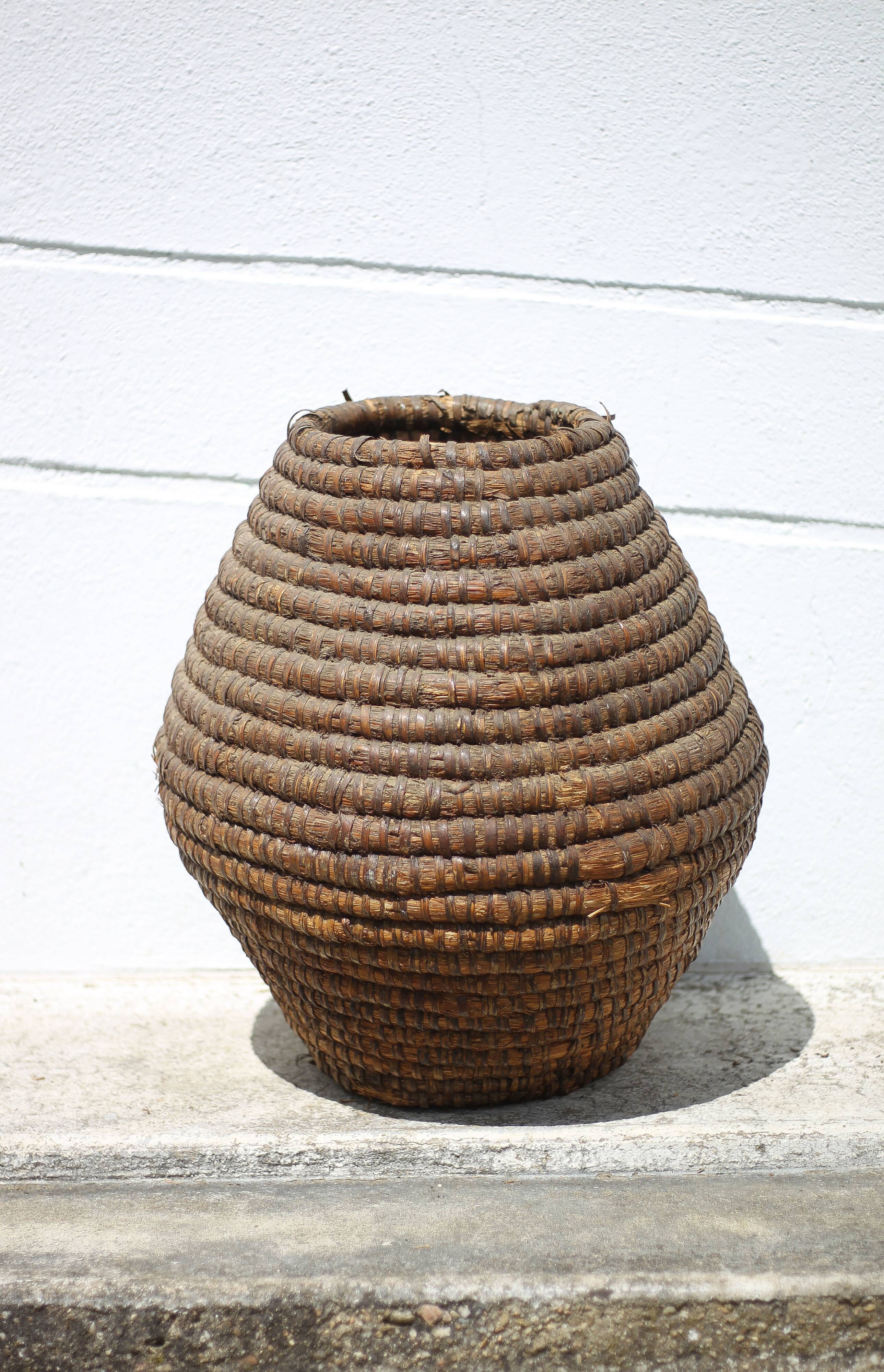 Old basket, burgundy straw and bramble, woven basket, interior decoration