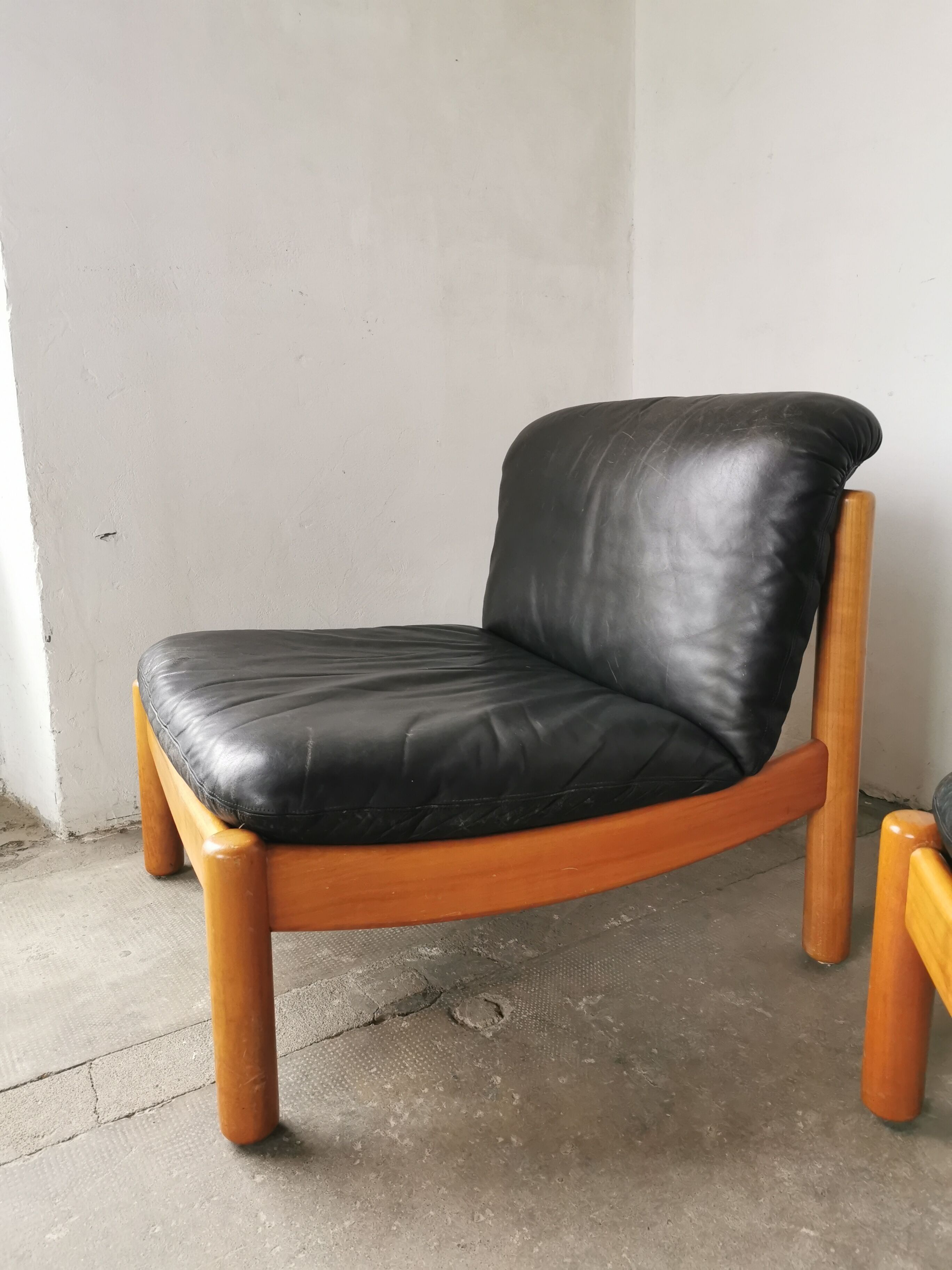 Pair of designer leather armchairs 80s