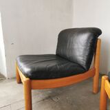 Pair of designer leather armchairs 80s
