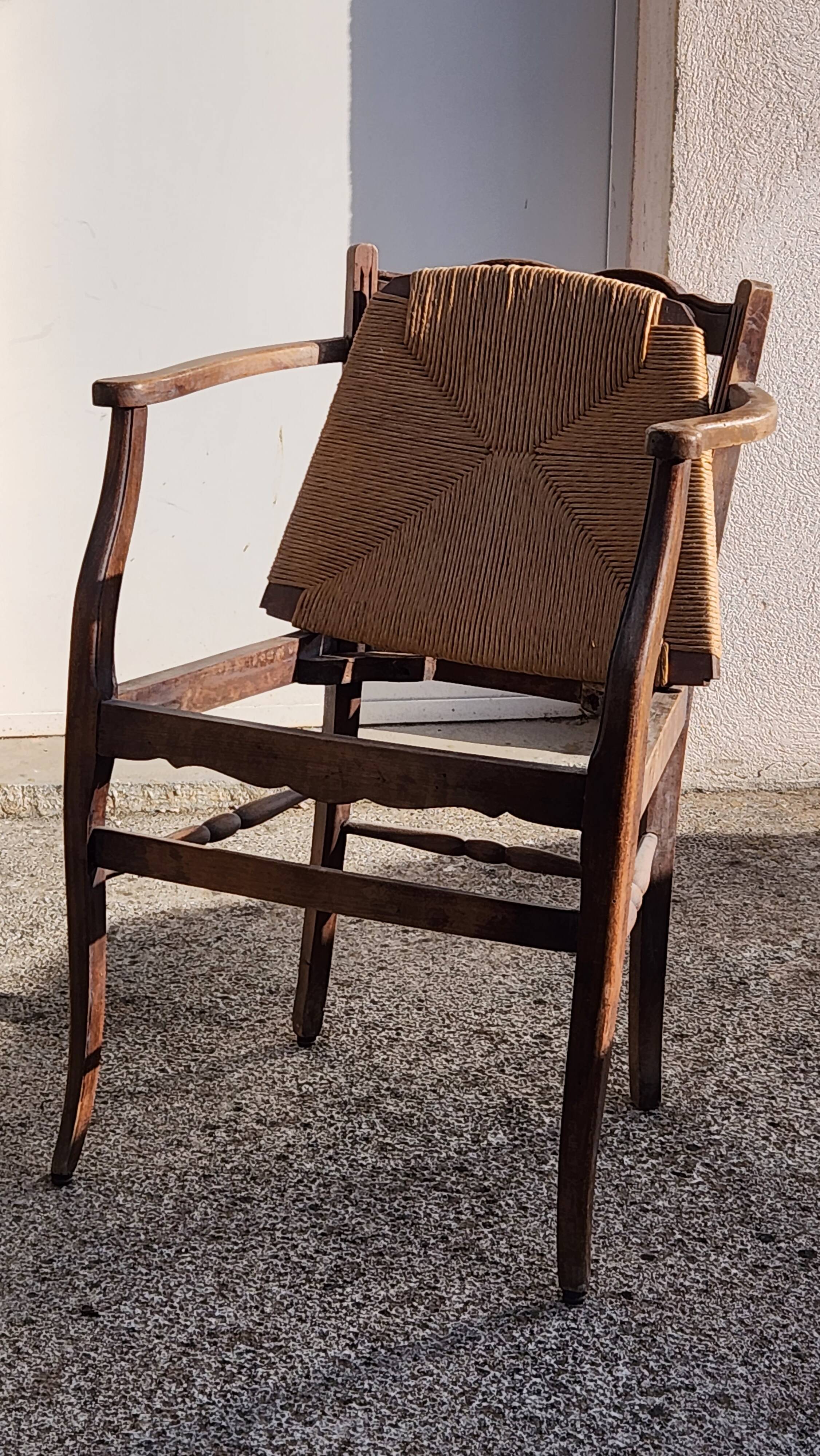 Rustic armchair made of wood and straw
