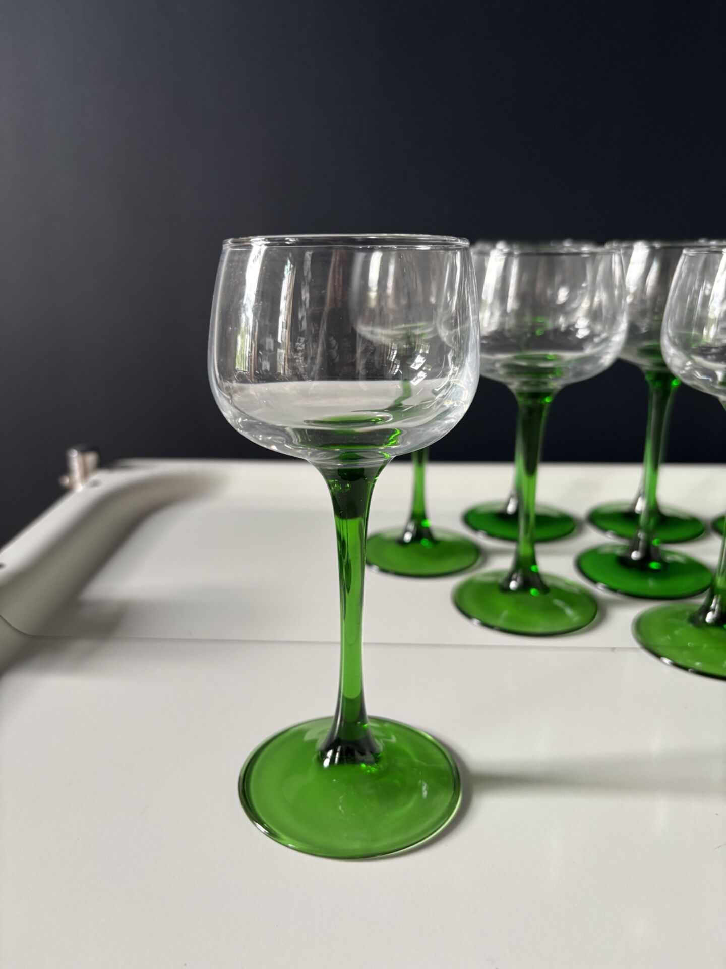 Set of 12 Alsatian Roemer glasses with green stems.