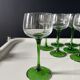 Set of 12 Alsatian Roemer glasses with green stems.