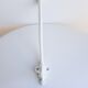 White peg in metal