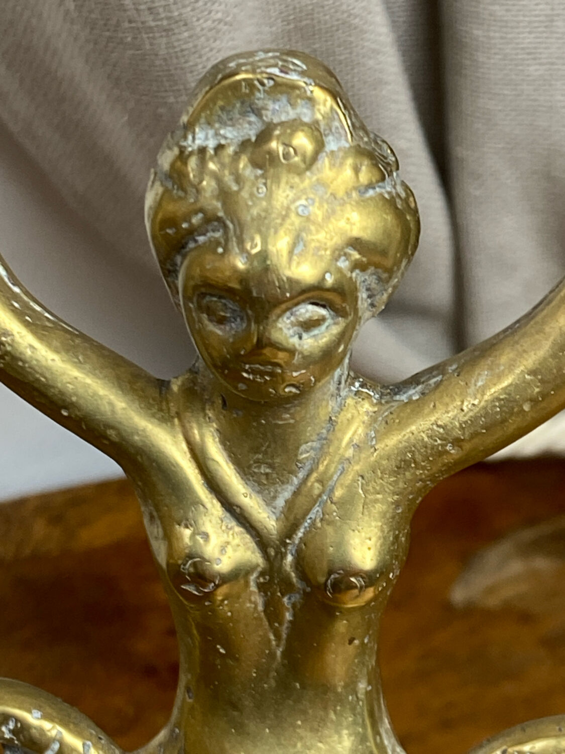 Mermaid-shaped chandelier in bronze