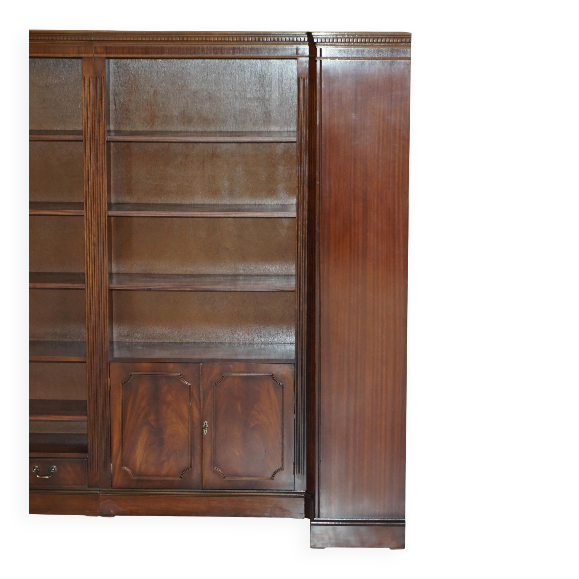 Corner library made of flamed hardwood, in 3 parts.