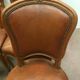 Suite de six chaises en noyer avec assises cuir, style Louis XV