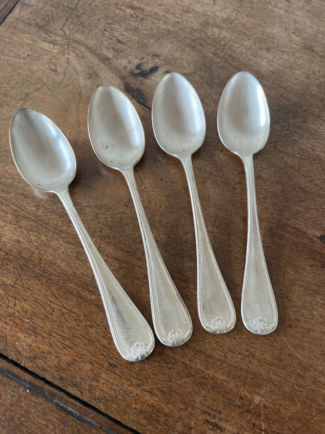 4 teaspoons in silver metal