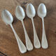 4 teaspoons in silver metal
