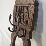Coat rack with 2 hooks on a frieze of divinities in teak