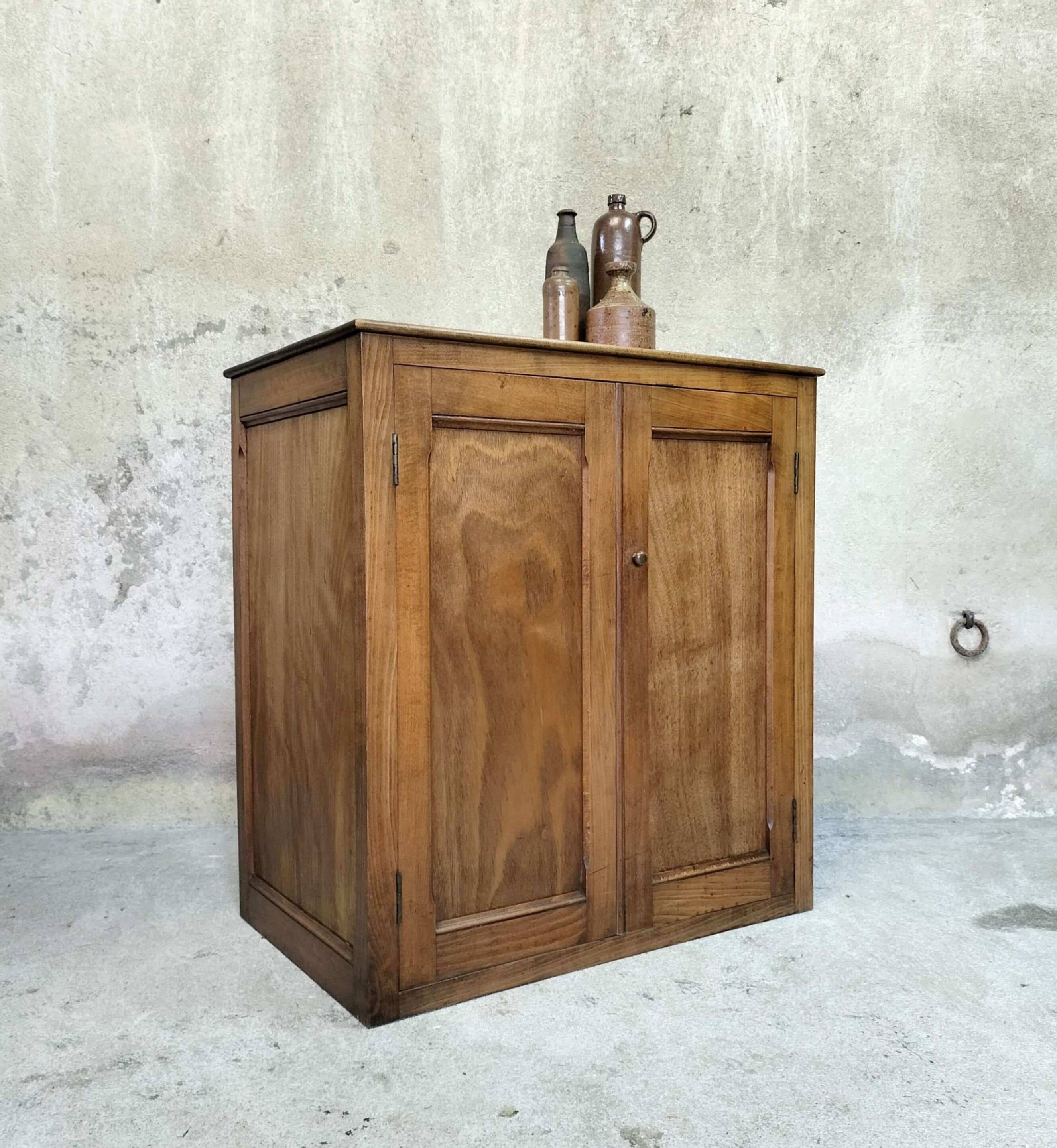 Small wooden sideboard with two doors.