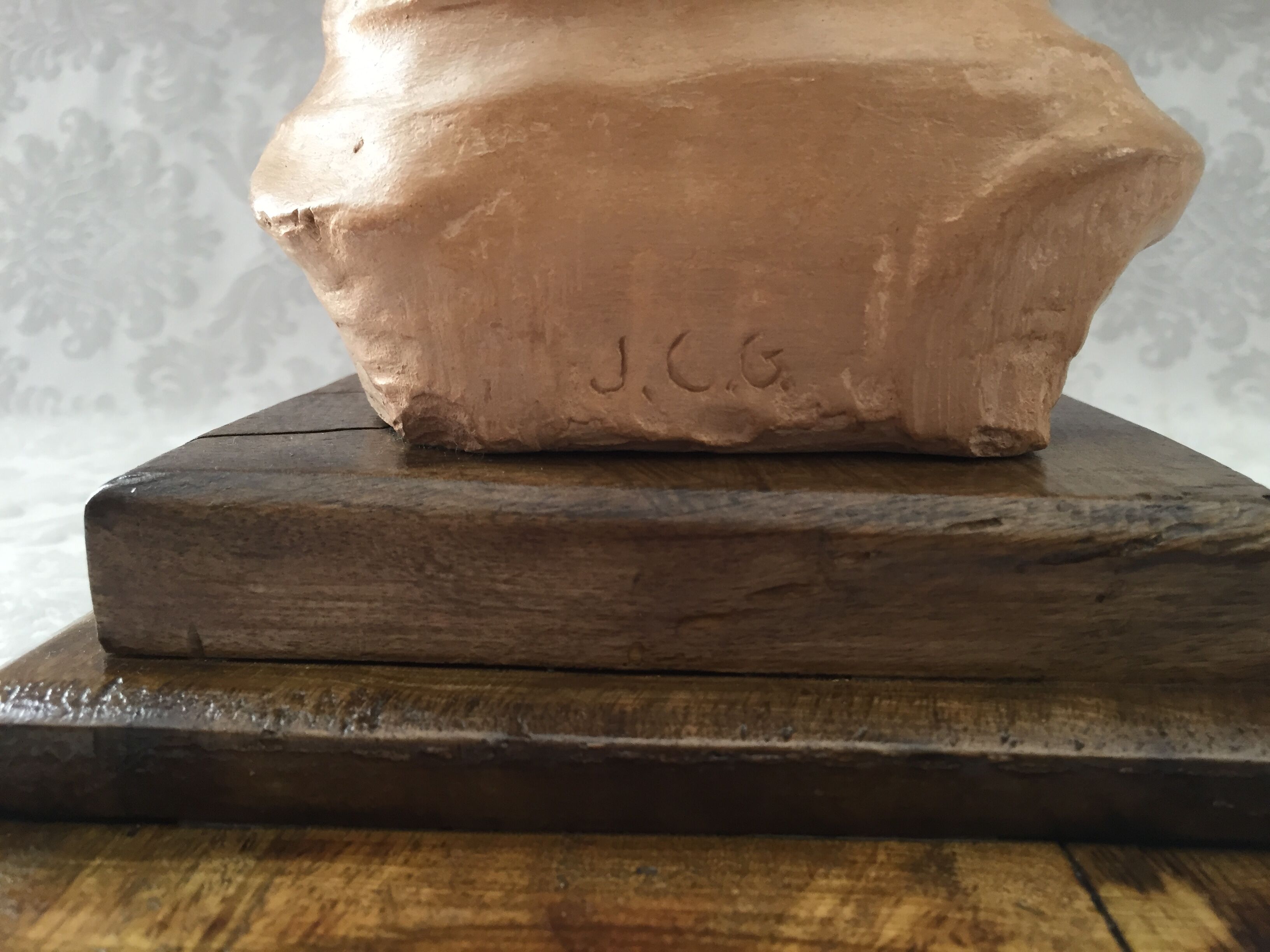 Bust in raw earth of atelier bust face of woman signed j.c.g.