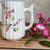 Small pitcher in iron earth with double old decoration