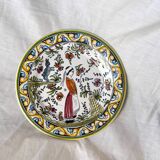 Decorative plate with medieval, Breton and rabbit decoration surrounded by plants - Breton earthenware