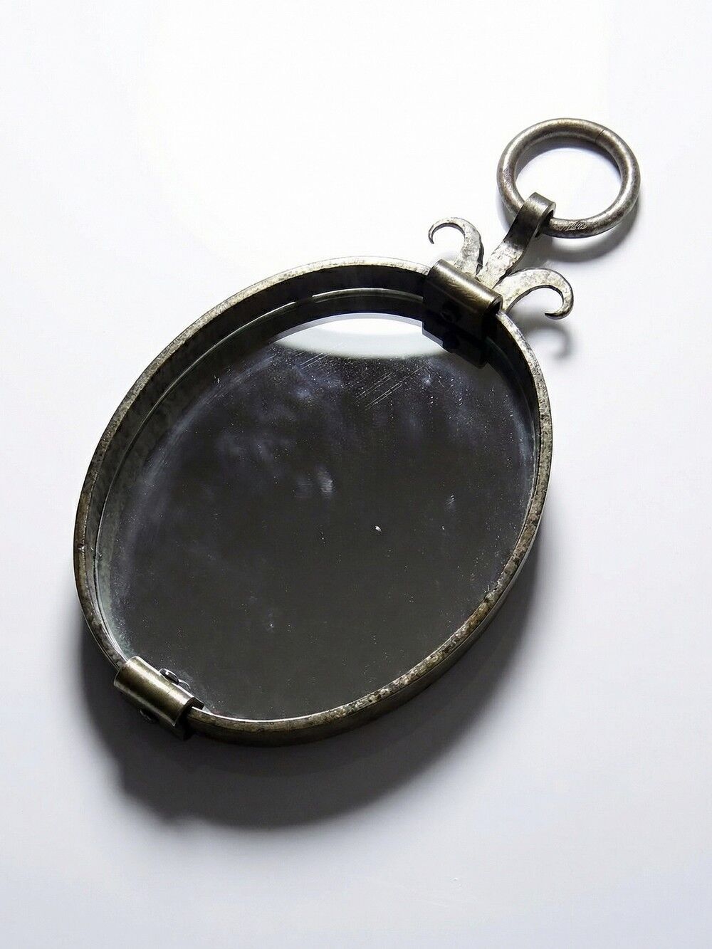 Oval mirror in handcrafted wrought iron, mid-century brutalist vintage from the 50s-70s.