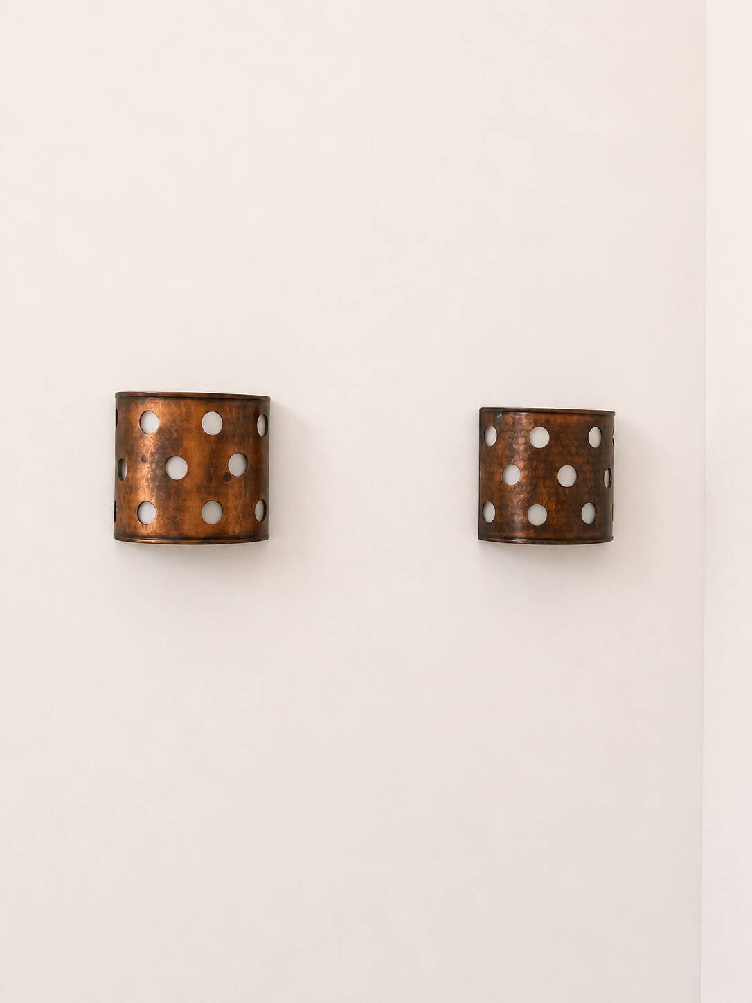 Pair of vintage wall sconces, hammered copper, France, 1970.