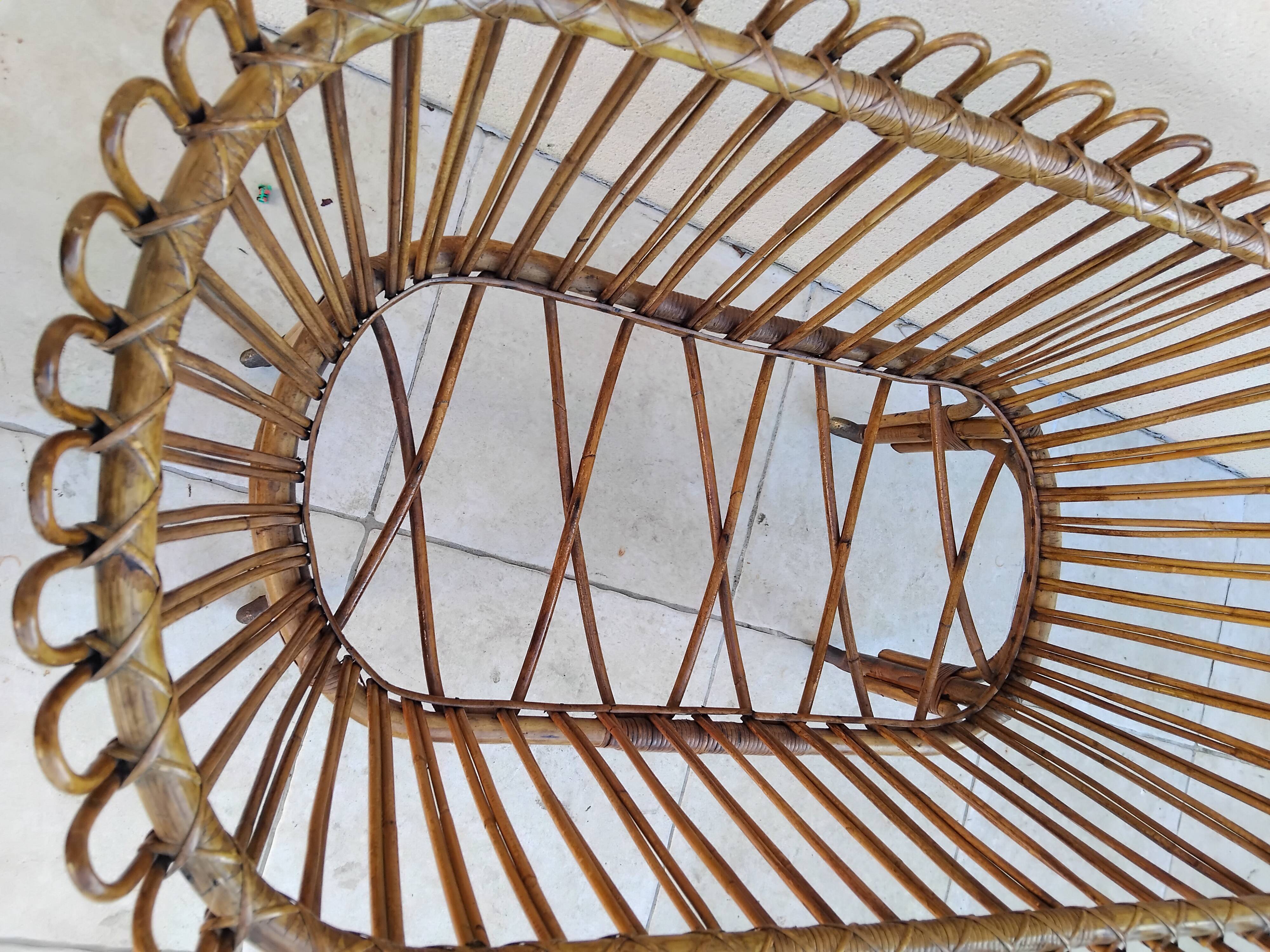 Vintage rattan bed on wheels cradle