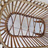 Vintage rattan bed on wheels cradle
