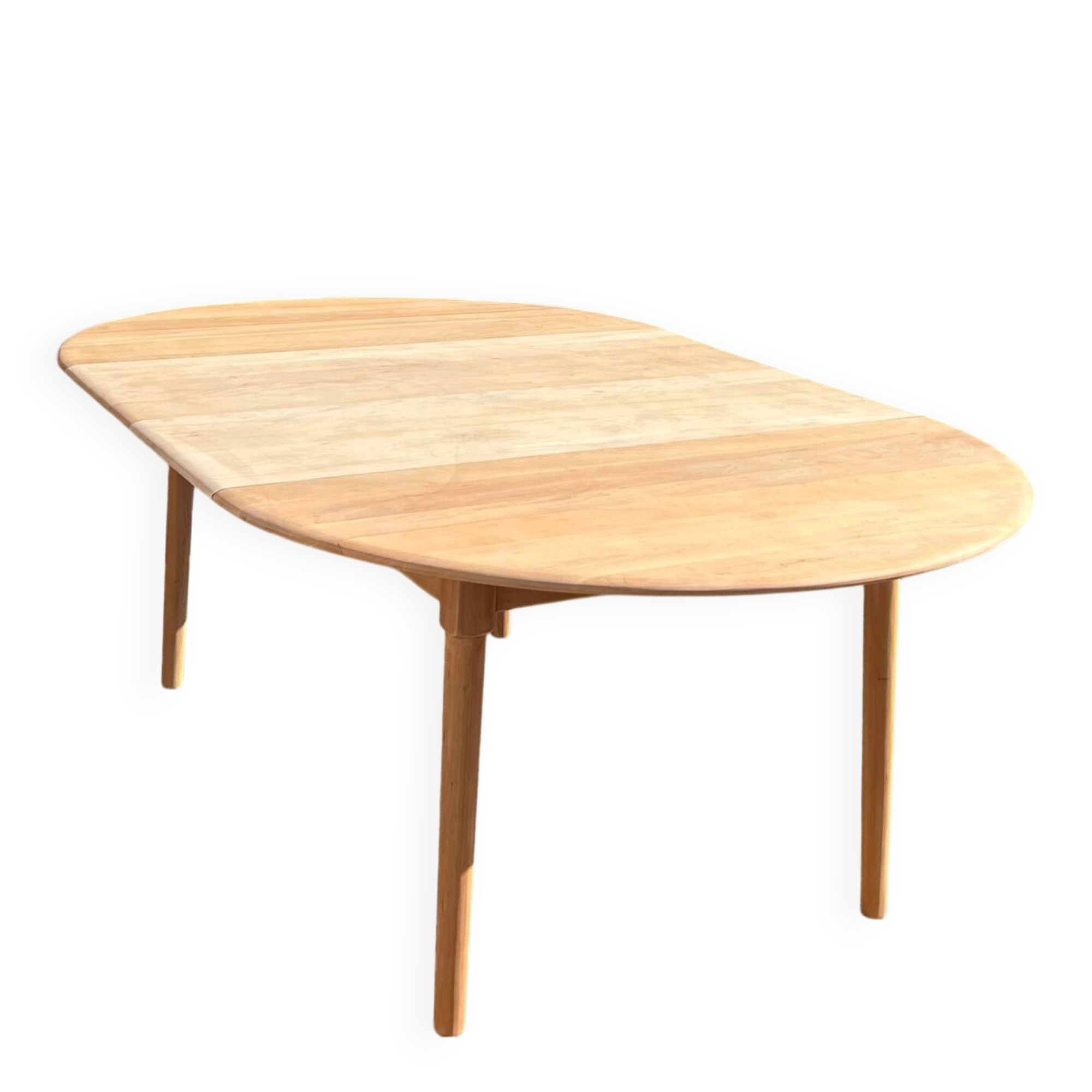 Large round family table with 2 extensions in solid raw wood.