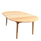 Large round family table with 2 extensions in solid raw wood.
