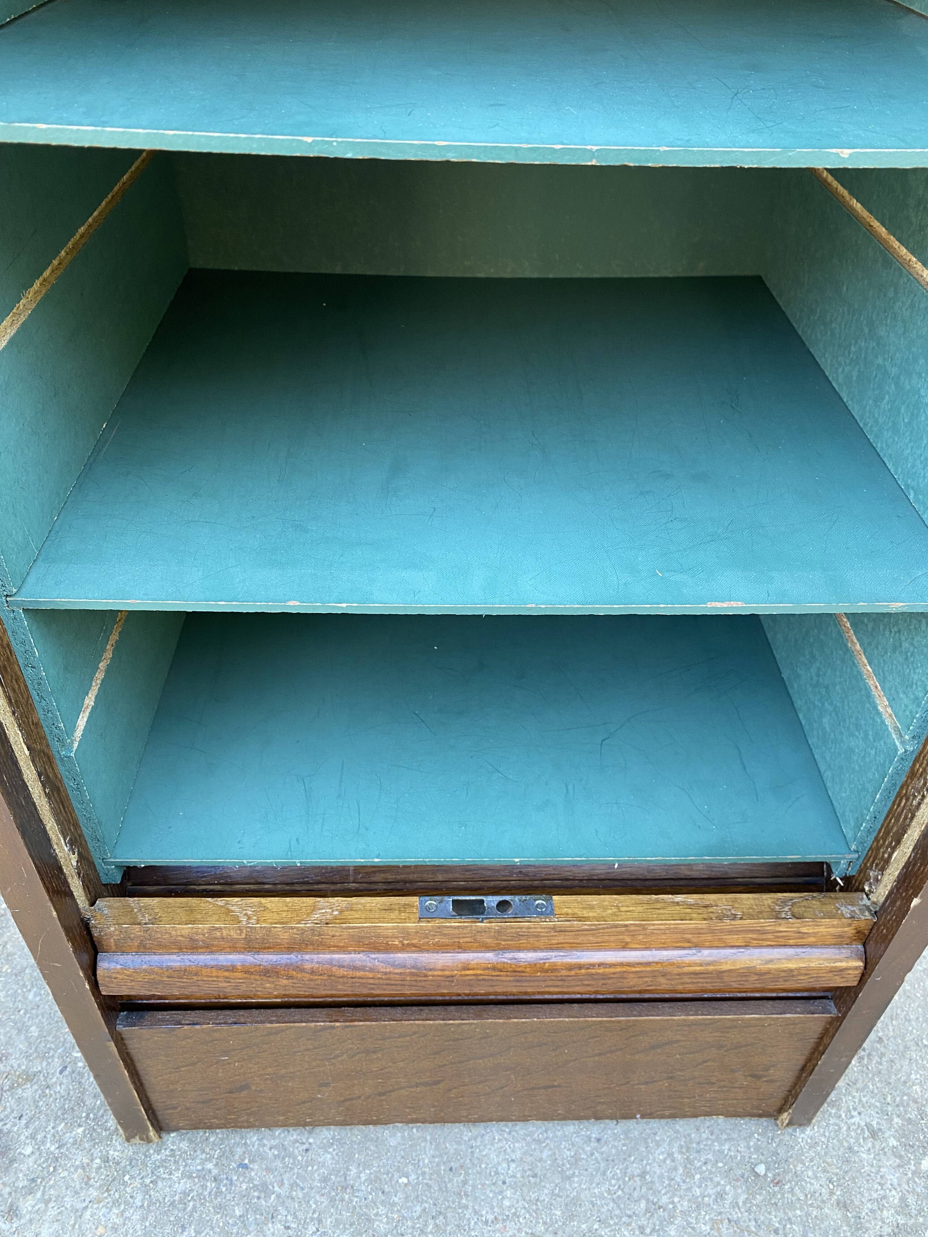 1970 oak office storage cabinet with curtains.