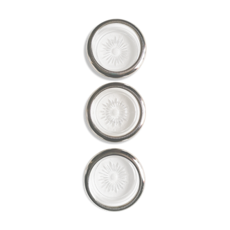 Three under silver-plated bottles