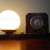 Table lamp with pendulum