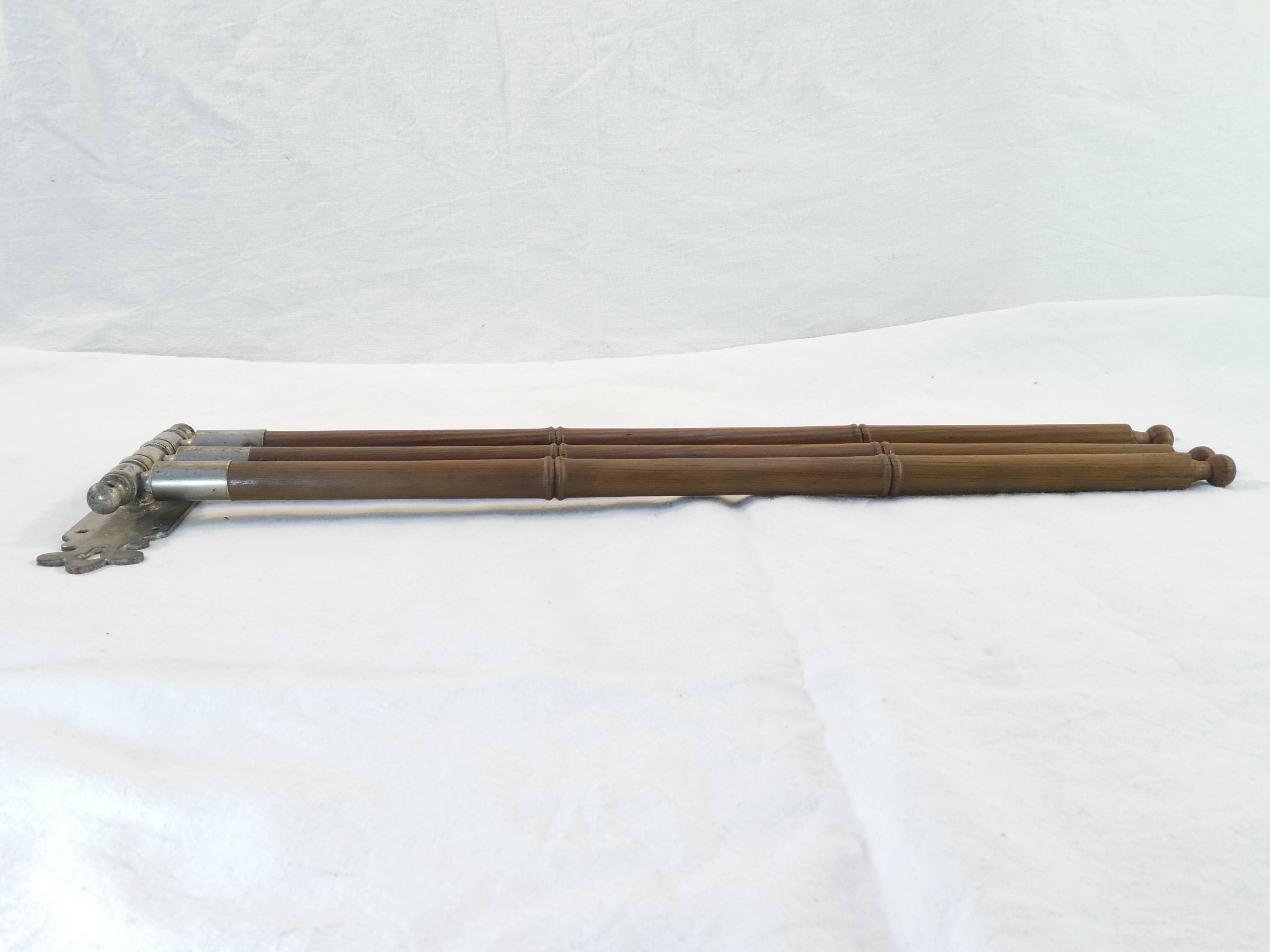 Antique towel rack has three arms