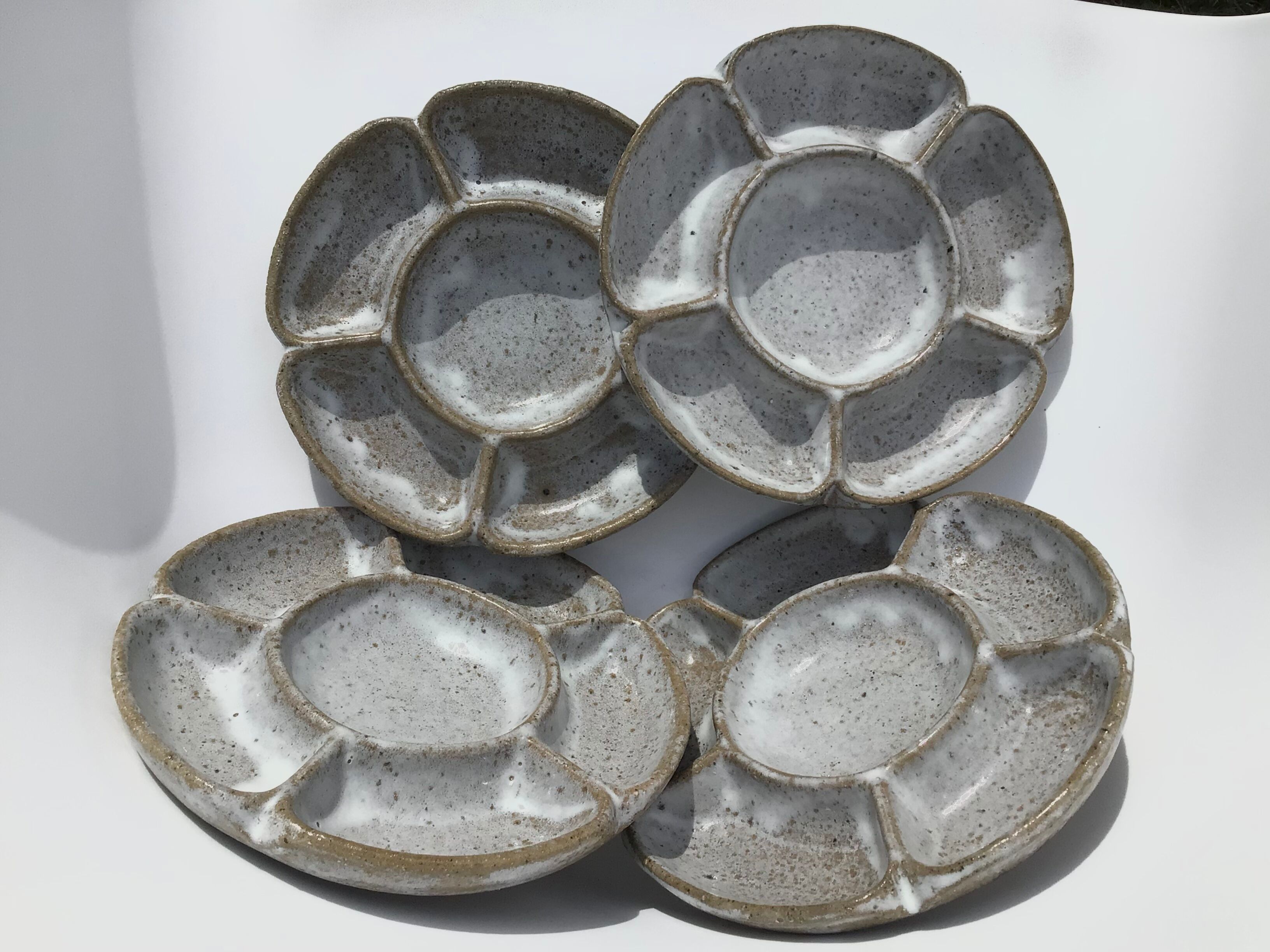 4 White compartmentalized handmade stoneware plates