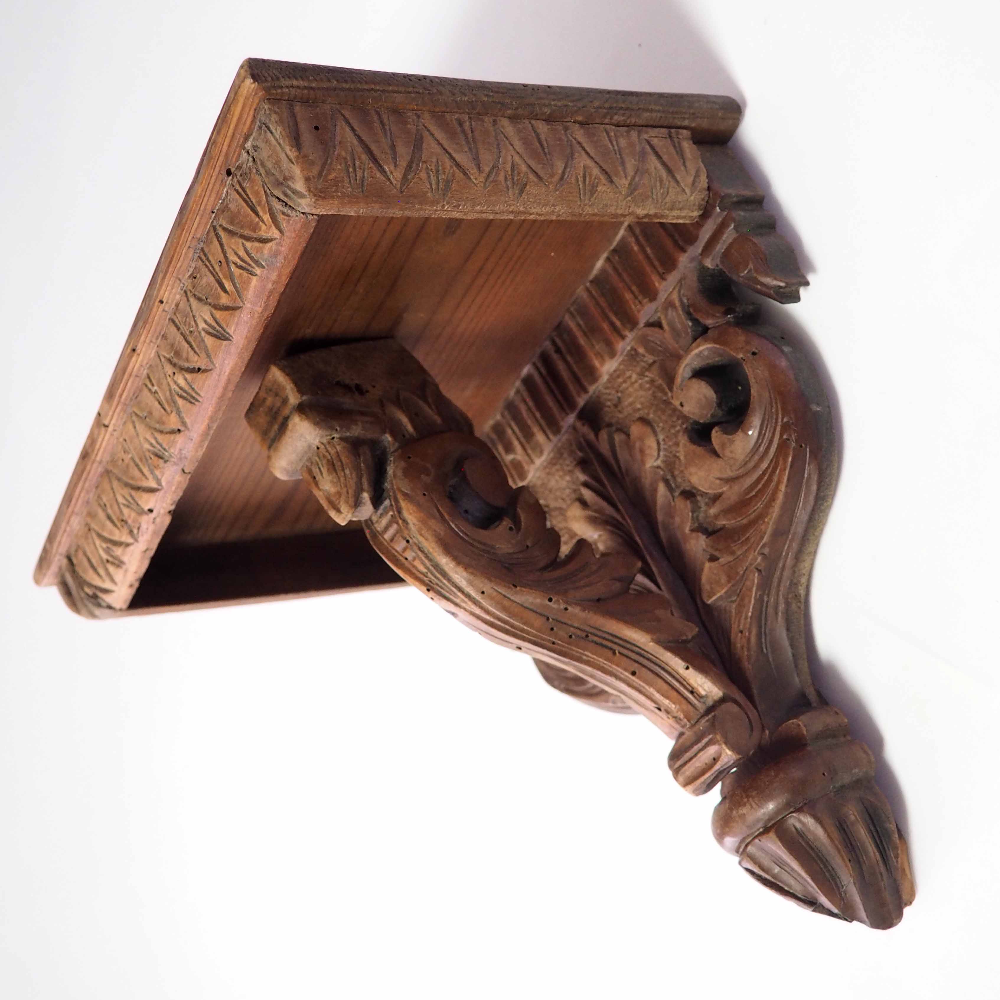 Carved wooden shelf
