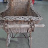 Landau vintage in wicker and brown wood, 1930s, large wheels and metal structure.