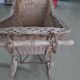 Landau vintage in wicker and brown wood, 1930s, large wheels and metal structure.