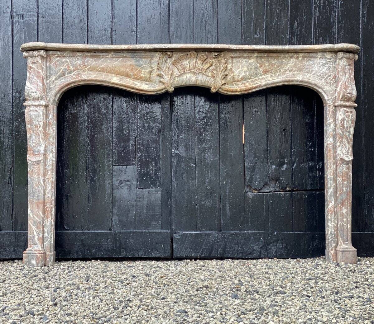 Early 19th century Louis XV style fireplace in grey Ardennes marble