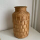 Green glass jar with wickerwork