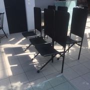 Set of 6 dining room chairs with tripod legs in grained leather and metal 1970