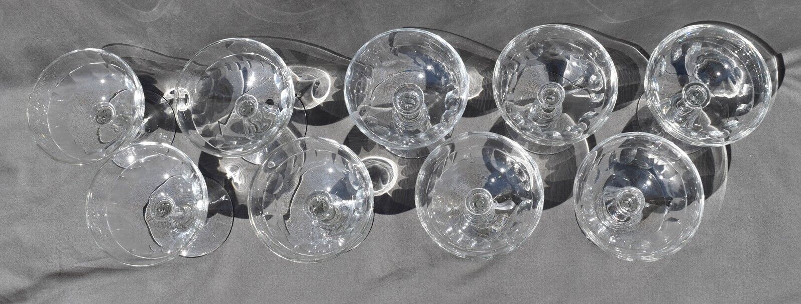 9 old champagne glasses in flat-waisted blown glass