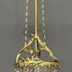 Antique chandelier in gilded bronze with crystal pendants.