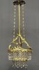 Antique chandelier in gilded bronze with crystal pendants.