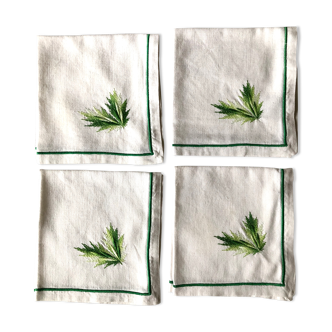 Série de quatre serviettes de table en lin brodé