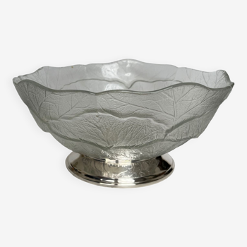 Glass cup on silver metal pedestal