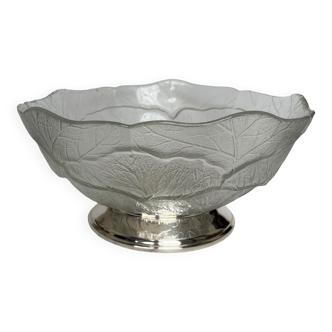Glass cup on silver metal pedestal