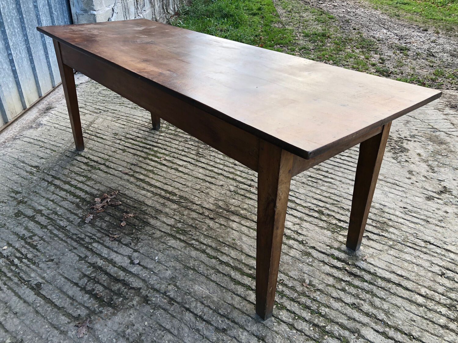 Antique chestnut farmhouse table with 3 drawers on the front.