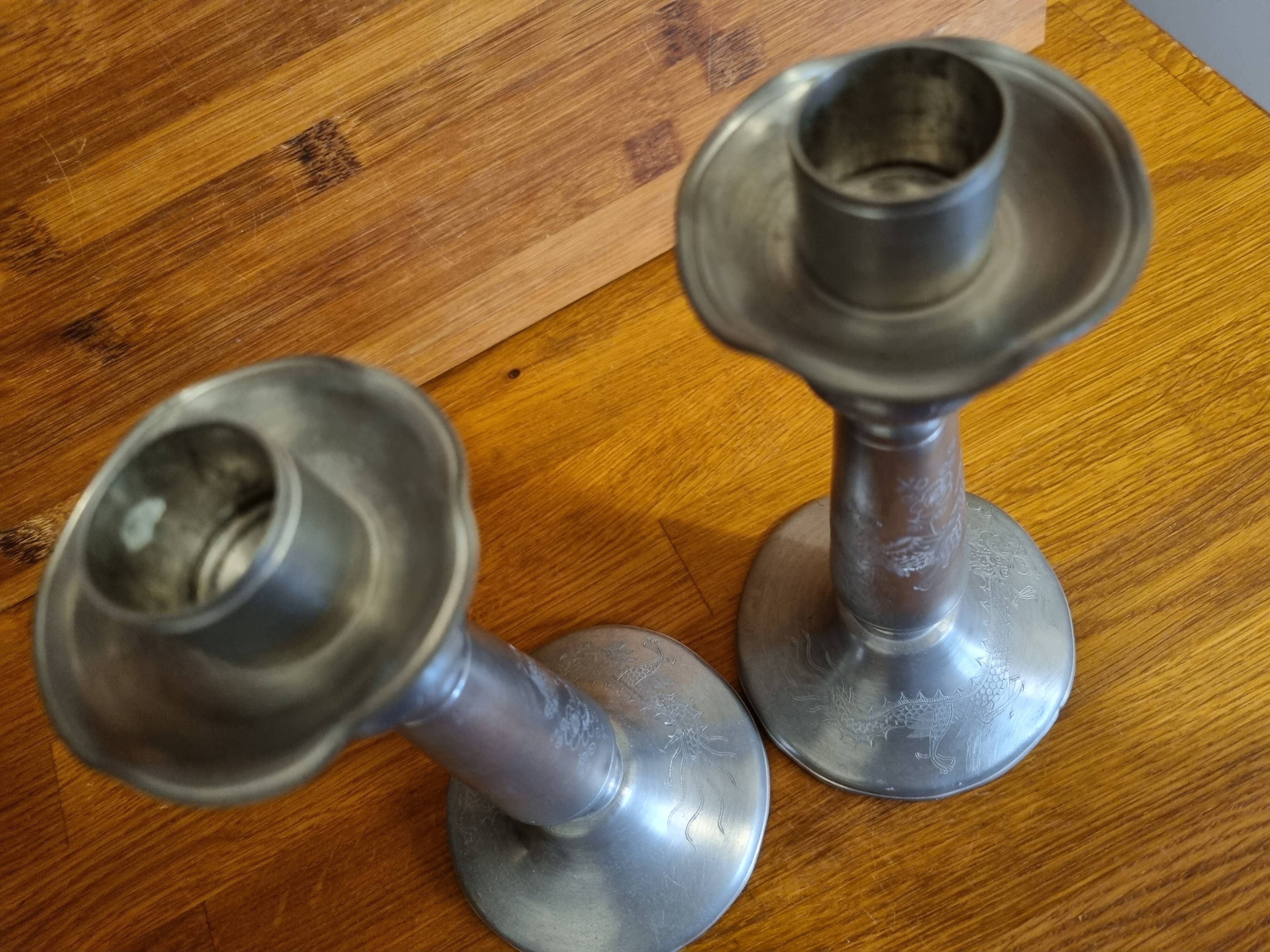 Pair of old Chinese candlesticks in engraved pewter