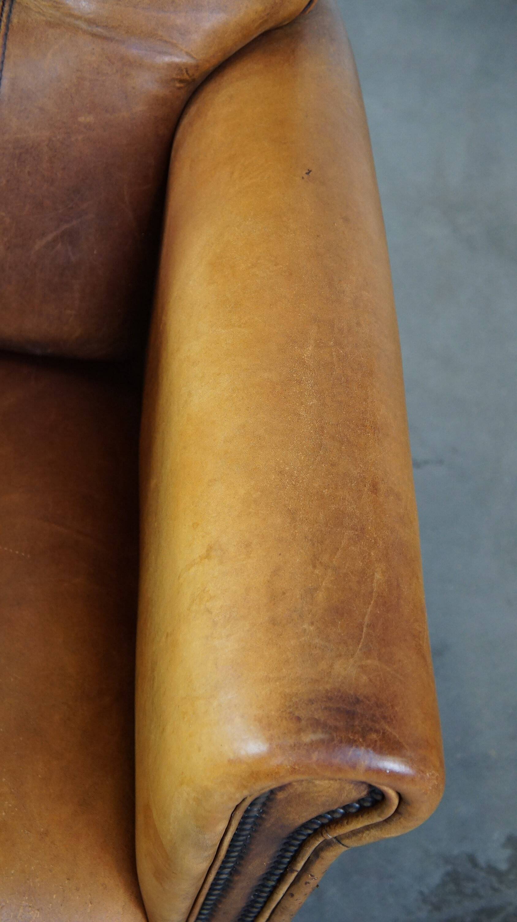 Stately, sleekly finished, comfortable sheepskin armchair